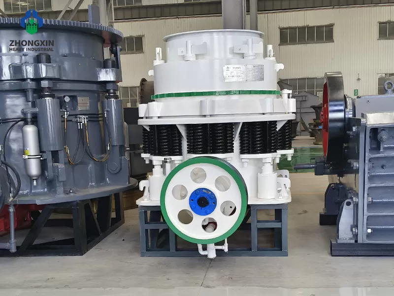 PSG Symons cone crusher front view in factory workshop with cast steel frame