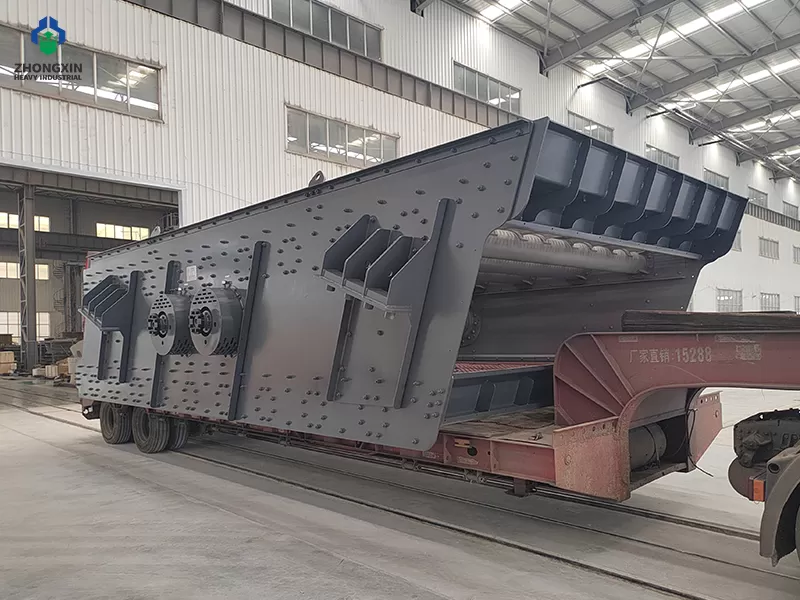 Aggregate vibrating screen discharge end with multiple discharge chutes