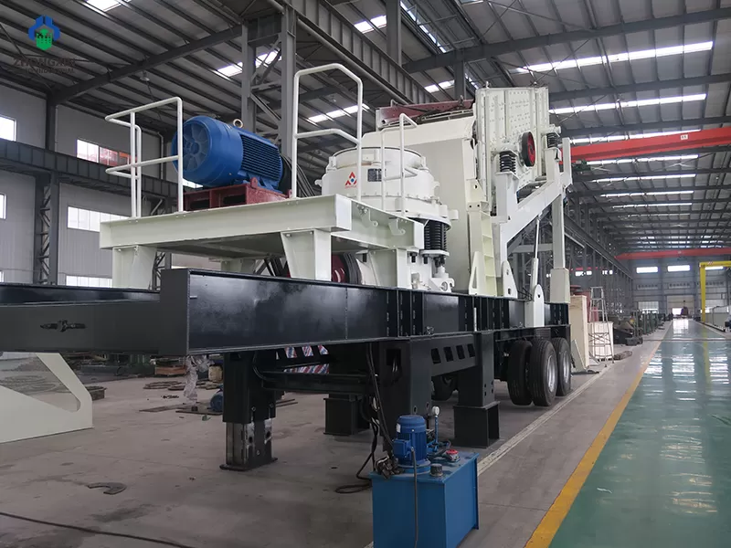 Mobile stone crusher side view showing vibrating feeder and discharge belt