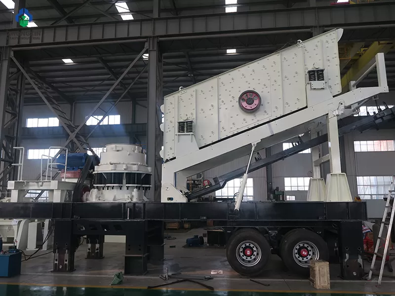 Mobile stone crusher machine motor and drive system at factory workshop