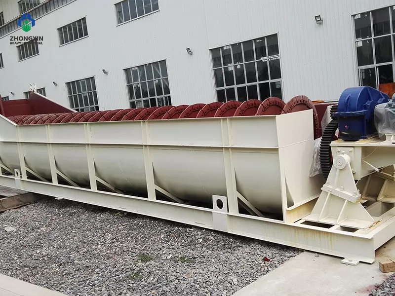Installing interchangeable manganese steel wear shoes onto a heavy duty screw classifier shaft.