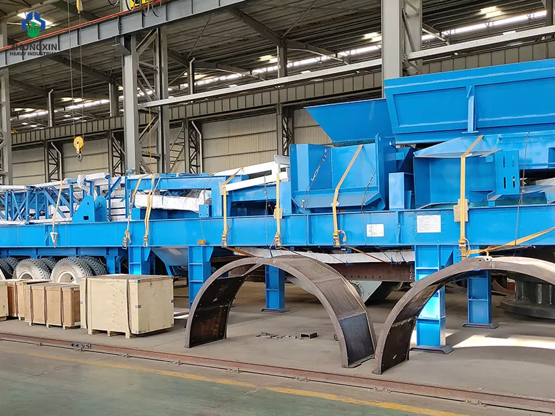 Portable jaw crusher plant motor and V-belt drive system at workshop