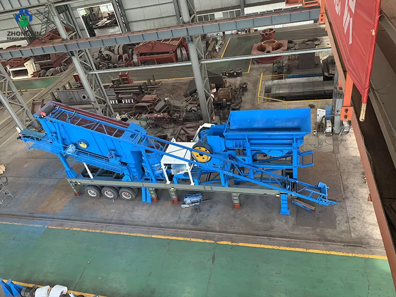 Mobile jaw crushing plant side view showing vibrating feeder and discharge belt
