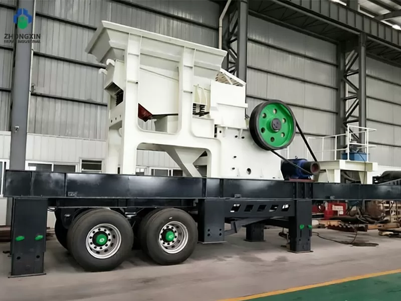 Mobile jaw crusher manufacturer assembly line showing tracked undercarriage