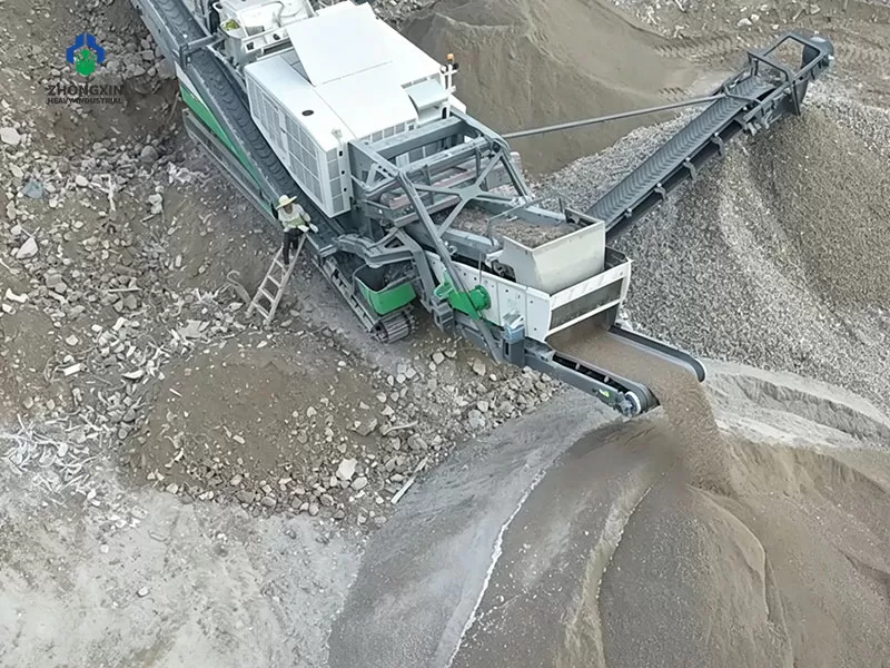 Portable jaw crusher motor and V-belt drive system at factory workshop