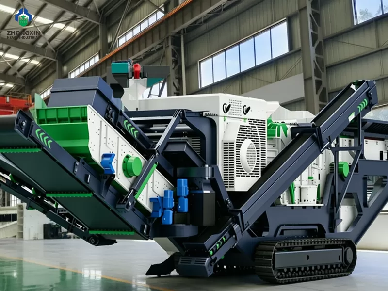 Crawler impact crusher station assembly in workshop with tracked chassis